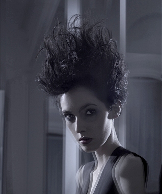 A long black straight spikey messy wavy hairstyle by Charlie Miller