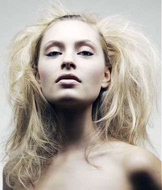 A long blonde straight frizzy frizzed tight-curled messy hairstyle by Michael Barnes