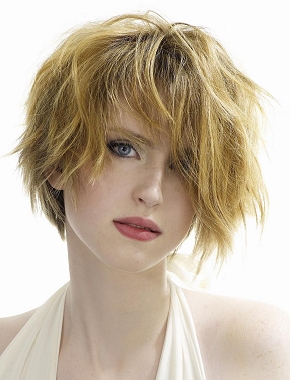 A medium blonde straight coloured shaggy messy hairstyle by Eric Stipa