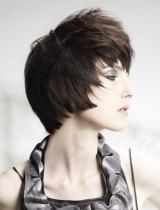 Short Brown Curly Hairstyle by Bonce Salons