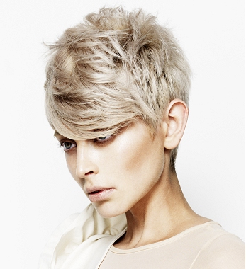 A short blonde straight spikey coloured hairstyle by Cream