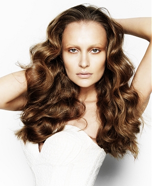 A long brown wavy coloured hairstyle by Cream