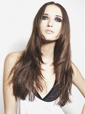 A long brown straight feathered hairstyle by Tigi