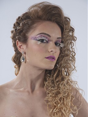 A long blonde wavy curly coloured plaited updo loose hairstyle by Andrade Oliveira