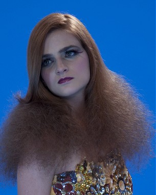 A long brown straight backcombed frizzy hairstyle by Andrade Oliveira