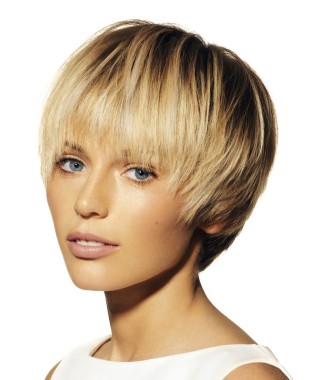 A short blonde straight coloured multi-tonal hairstyle by Eric Stipa