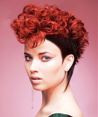 A medium red curly coloured multi-tonal quiff shaved-sides hairstyle by William De Ridder