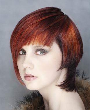 A short red straight coloured multi-tonal hairstyle by William De Ridder