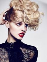 Blonde Curly Hairstyle by Hoop Haircutters