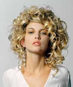 A long blonde curly hairstyle by Razors Edge